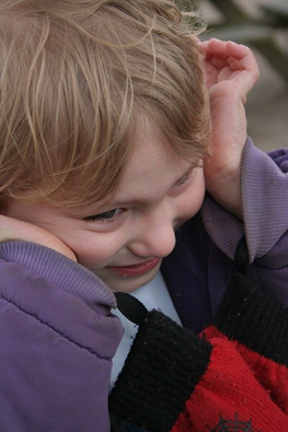 ASD Child Covering Ears